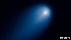 Comet ISON is shown in this NASA handout image photographed by the Hubble telescope on April 10, 2013.