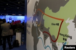 FILE - A map illustrating China's silk road economic belt and the 21st century maritime silk road, or the so-called "One Belt, One Road" megaproject, is displayed at the Asian Financial Forum in Hong Kong, China, Jan. 18, 2016.