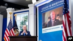 President Joe Biden participates in the White House COVID-19 Response Team's regular call with the National Governors Association in the South Court Auditorium in the Eisenhower Executive Office Building on the White House Campus, in Washington, Dec. 27, 2021.