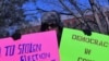 Protesters, like here at a recent rally outside the White House, have called for a new vote in the Democratic Republic of Congo.