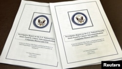 House Intelligence Committee's report on "national security threats posed by Chinese telecommunications companies Huawei and ZTE" is seen at a news conference in Washington, October 8, 2012.