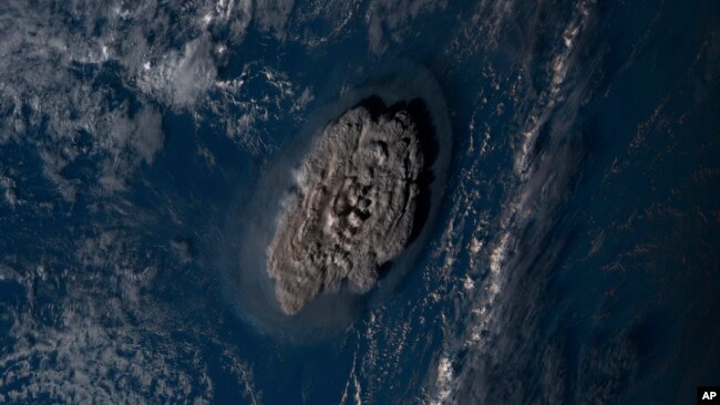 This satellite image taken by Himawari-8, a Japanese weather satellite operated by Japan Meteorological Agency and released by National Institute of Information and Communications Technology, shows an undersea volcano eruption at the Pacific nation of Ton