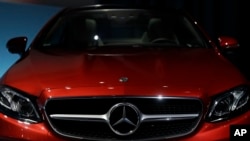 FILE - The nose of a Mercedes-Benz E-Class Coupe is seen in Stuttgart, Germany, 