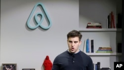 FILE -Airbnb co-founder and CEO Brian Chesky speaks during an announcement in San Francisco. Airbnb on Sept. 8 apologized for its slow response to accusations of racism and outlined new policies to combat the problem, including reducing the prominence of photos in the booking process. 