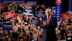 Republican presidential candidate Donald Trump takes the stage during the final day of the Republican National Convention in Cleveland, July 21, 2016. (AP Photo/Matt Rourke)