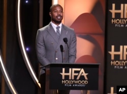 Michael B. Jordan, who starred in the movie, presents the Hollywood film award to "Black Panther" at the Hollywood Film Awards on Nov. 4, 2018, at the Beverly Hilton Hotel in Beverly Hills, California.