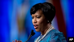 FILE - Washington Mayor Muriel Bowser, shown after taking the oath of office last month, defied a lawmaker's threat that she and other city leaders could face prison time for implementing a voter-approvedmarijuana law. 