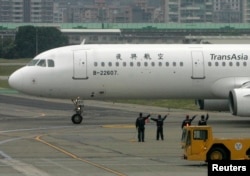 FILE - A TransAsia Airways plane at Taipei, Taiwan airport. There are now about 890 direct flights per week between the mainland and Taiwan.