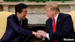 U.S. President Donald Trump meets with Japan's Prime Minister Shinzo Abe in the Oval Office at the White House in Washington, April 26, 2019. 