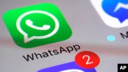 WhatsApp appears on a smartphone, March 10, 2017, in New York. 