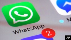 WhatsApp appears on a smartphone, March 10, 2017, in New York.