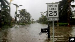 A street is flooded near the ocean after Hurricane Irma passed through Naples, Fla., Sept. 10, 2017. 