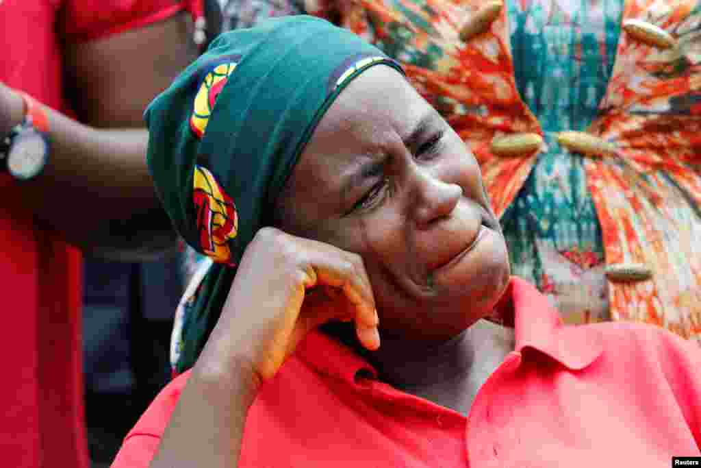 A parent of one of the abducted Chibok school girls cries after the police prevented the parents from seeing President Muhammadu Buhari during a rally in Abuja, Nigeria.