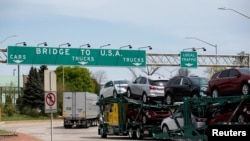 A car hauler heading for Detroit, Michigan, drives on the lane to Ambassador Bridge in Windsor, Ontario, Canada, April 28, 2017. 