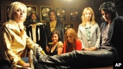 From left to right: Dakota Fanning, Mickey Petralia, Michael Shannon, Alia Shawkat, Scout Taylor-Compton, Stella Maeve and Kristen Stewart in “The Runaways”