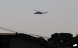 An Indian air force chopper on a reconnaissance mission flies over the Indian airbase in Pathankot, 430 kilometers (267 miles) north of New Delhi, India, Jan. 2, 2016.