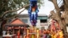 Lion dancers prepare for performances ahead of the Lunar New Year celebrations at a temple in Phnom Penh, Cambodia, January 26, 2022. Picture taken January 26, 2022. REUTERS/Cindy Liu