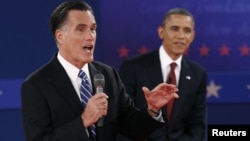 Republican presidential nominee Mitt Romney, left,and President Barack Obama during second U.S. presidential campaign debate, Hempstead, New York, October 16, 2012.