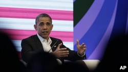 President Barack Obama participates in a three-way conversation with Brazil's President Dilma Rousseff and Colombia's President Juan Manuel Santos, not pictured, at the CEO Summit of the Americas, in Cartagena, Colombia, April 14, 2012.