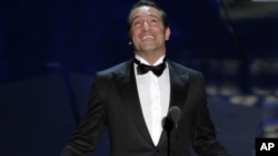 Jean Dujardin accepts the Oscar for best actor in a leading role for “The Artist” during the 84th Academy Awards on Feb. 26, 2012, in Hollywood.
