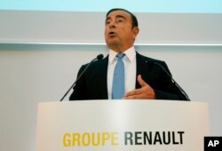 FILE - Then-Renault Group CEO Carlos Ghosn speaks during a media conference at La Defense business district, outside Paris, France, Oct. 6, 2017.