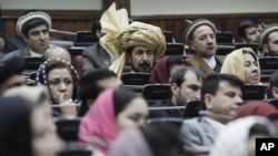 FILE - Afghan parliament members are seen in session.