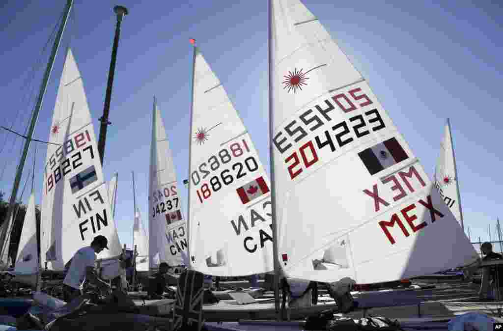Sailors prepare their Lasers for racing in the ISAF Sailing World Cup Miami in Miami, Florida. The world's top Olympic and Paralympic class competitors are racing on Biscayne Bay Jan. 27-Feb. 1 with hopes of qualifying for the 2016 Olympic and Paralympic games.