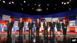 Republican presidential candidates John Kasich, Jeb Bush, Marco Rubio, Donald Trump, Ben Carson, Ted Cruz, Carly Fiorina and Rand Paul take the stage before the Republican presidential debate at the Milwaukee Theatre, Nov. 10, 2015, in Milwaukee. 