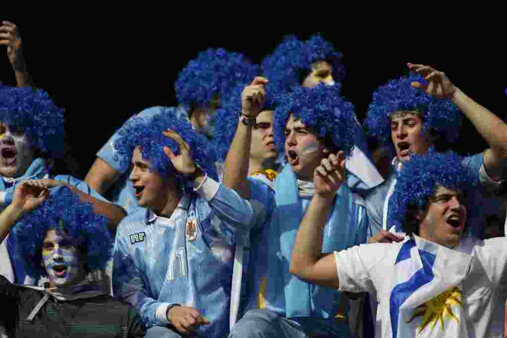 Uruguayan fans cheer before the Copa America final soccer match between Uruguay and Paraguay in Buenos Aires, Argentina, Sunday, July 24, 2011. Uruguay is trying to become the tournament's most successful team, while Paraguay is looking to prove it deserv