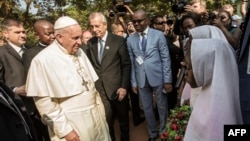 Pope Francis arrives at the Central Mosque in the PK5 neighborhood to meet with members of the Muslim community in Bangui, Nov. 30, 2015.. 