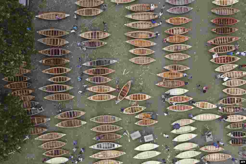 An aerial view shows a traditional wooden boat market in Manikganj, Bangladesh.