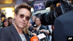 FILE - Robert Downey Jr. is interviewed at the premiere for the film "The Avengers Age of Ultron" in London, April, 21, 2015.