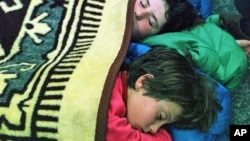 FILE - Sleeping children 