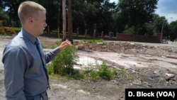 Empty buildings in bad shape were torn down by a naval base at the edge of town.