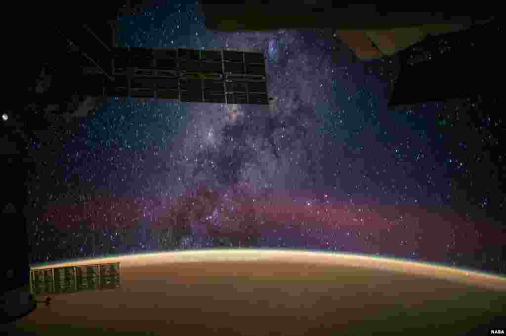 NASA astronaut Reid Wiseman captured this image from the International Space Station and posted it to social media, saying "The Milky Way steals the show from Sahara sands that make the Earth glow orange."