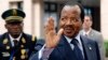 FILE - Cameroon's president, Paul Biya, waves as he arrives at an EU-Africa summit on April 3, 2014, at EU Headquarters in Brussels. In a rare public appearance, Biya on Friday paid homage to four top military officers killed in a helicopter crash last month and urged fellow citizens to unite in the fight against Boko Haram.