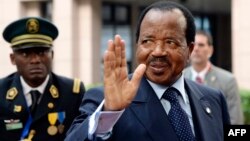 FILE - Cameroon's President Paul Biya waves as he arrives at an EU-Africa summit on April 3, 2014, at EU Headquarters in Brussels.