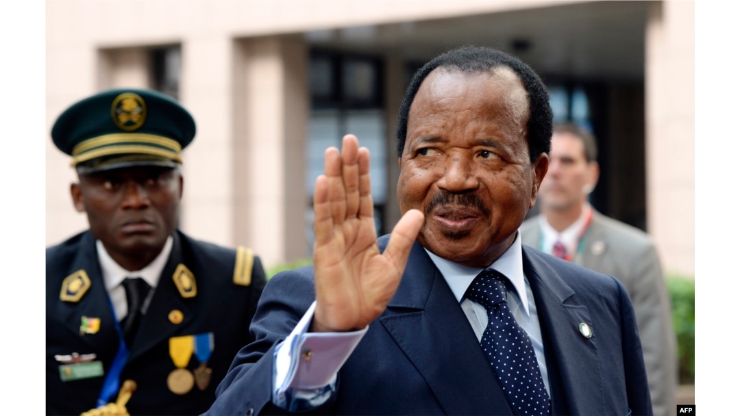 FILE - Cameroon's President Paul Biya waves.