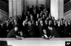 FILE - President Richard Nixon and Soviet Communist Party leader Leonid Brezhnev afix their signatures to the Strategic Arms Limitations agreement in Vladmir Hall of the Kermlin, Moscow, May 26, 1972.