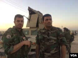 Peshmerga soldier Seehat Selman, right, says he is deeply disturbed that the international community, particularly the U.S. has not stepped in to help the Kurdistan Region in this battle on Oct. 20, 2017 in Altun Kobri, a disputed area of northern Iraq. (H.Murdock/VOA)