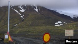 Warning signs block the road to Bardarbunga volcano, some 20 kilometers (12.5 miles) away, in the north-west region of the Vatnajokull glacier, Iceland, Aug. 19, 2014.