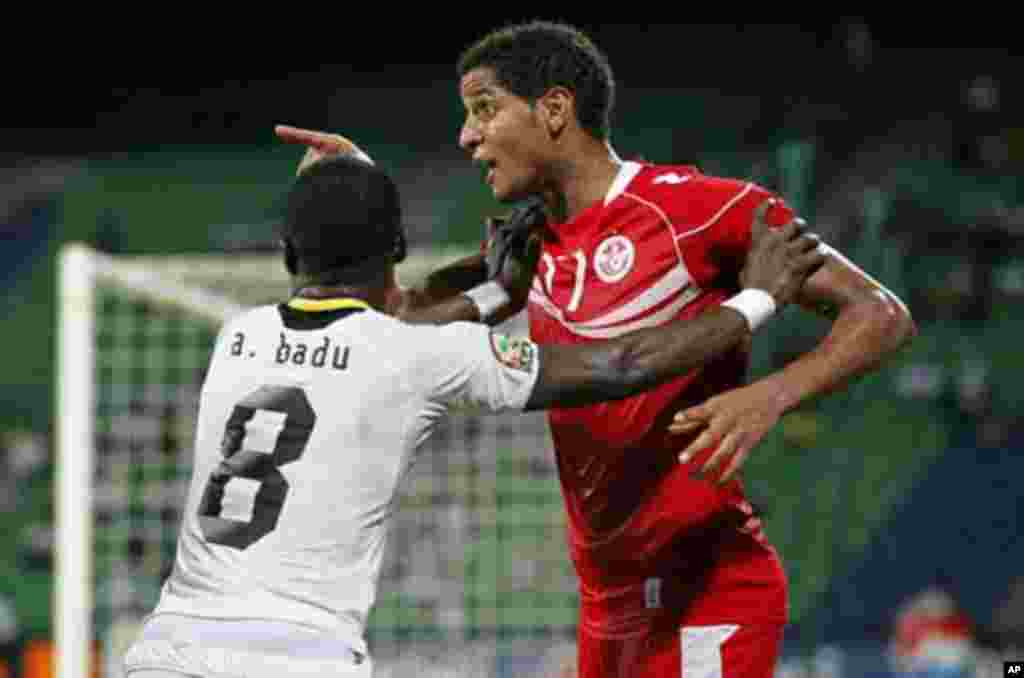 Tunisia's Aymen Abdennour (R) reacts during their African Nations Cup quarter-final soccer match against Ghana at Franceville stadium February 5, 2012.