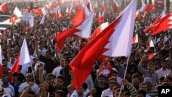 Tens of thousands of Bahraini anti-government protesters jam the main highway in Manama, Bahrain, February 22, 2011