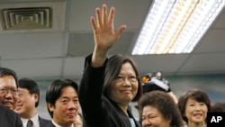 FILE - Taiwan's main opposition Democratic Progressive Party, DPP, Chairperson Tsai Ing-wen waves at the close of a press conference in Taipei, Taiwan.