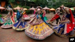 These dancers certainly aren't giving the "same old song and dance." They are performing a traditional dance of Gujarat state, ahead of Hindu festival Navratri in Ahmadabad, India, Sunday, Sept. 22, 2019.