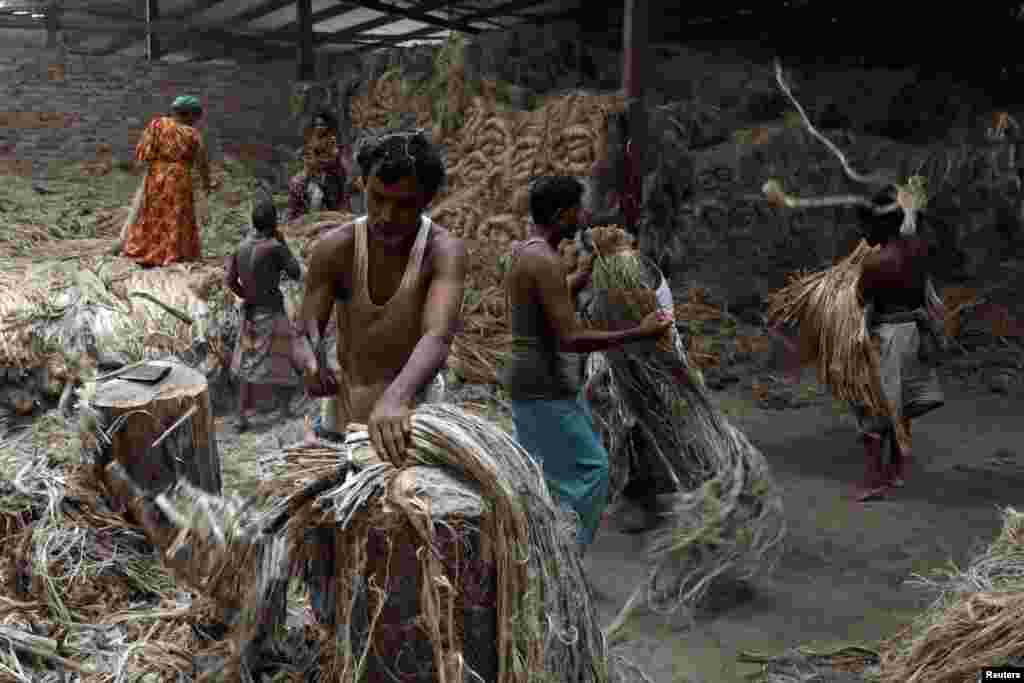 Employees work in a jute-processing mill in Narayanganj near Dhaka, Bangladesh.