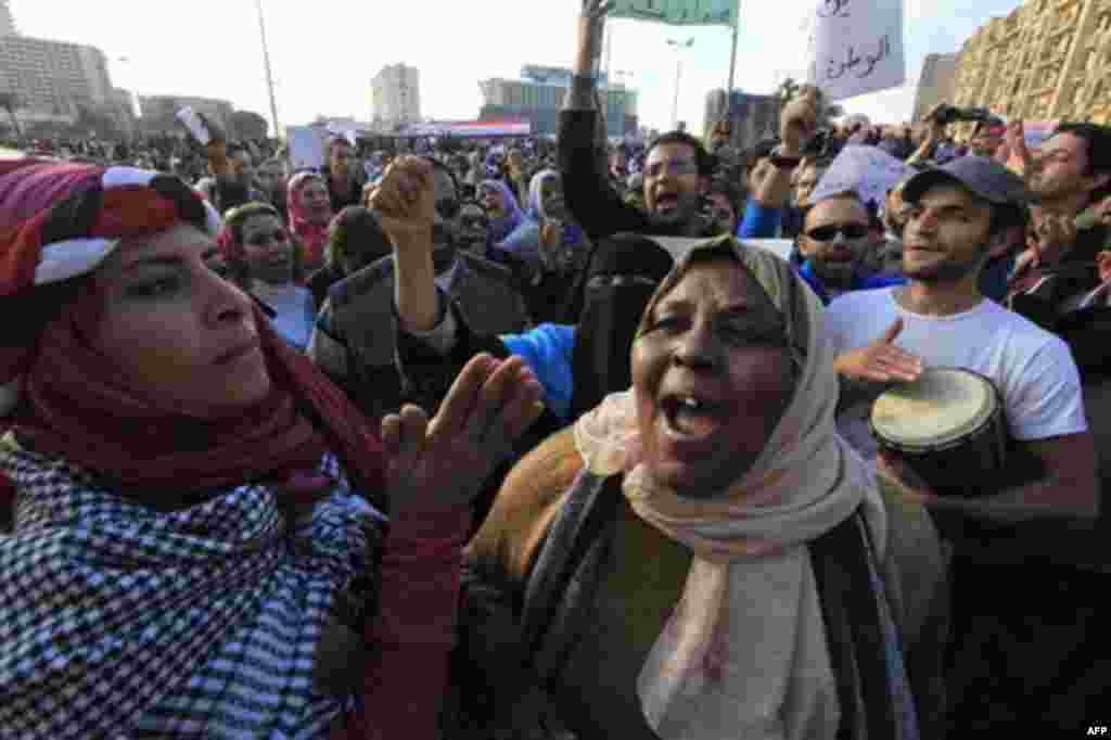 People chant anti-government slogans during a protest in the capital's central Tahrir, or Liberation, Square, Cairo, Egypt, Monday Jan. 31, 2011. A coalition of opposition groups called for a million people to take to Cairo's streets Tuesday to ratchet up
