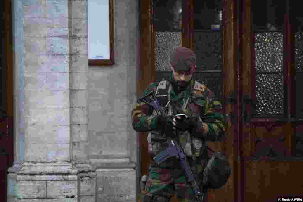 Soldiers and police are out in force in Brussels, as authorities search for men suspected of plotting attacks on the European Union.