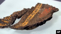 A painted wooden box fragment, claimed to be the only surviving example of early Anglo-Saxon painted woodwork, on display at Southend Central Museum in Southend, England, May 8, 2019. 