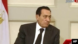 Egypt's President Mubarak attends a meeting in Cairo, Jan 30, 2011